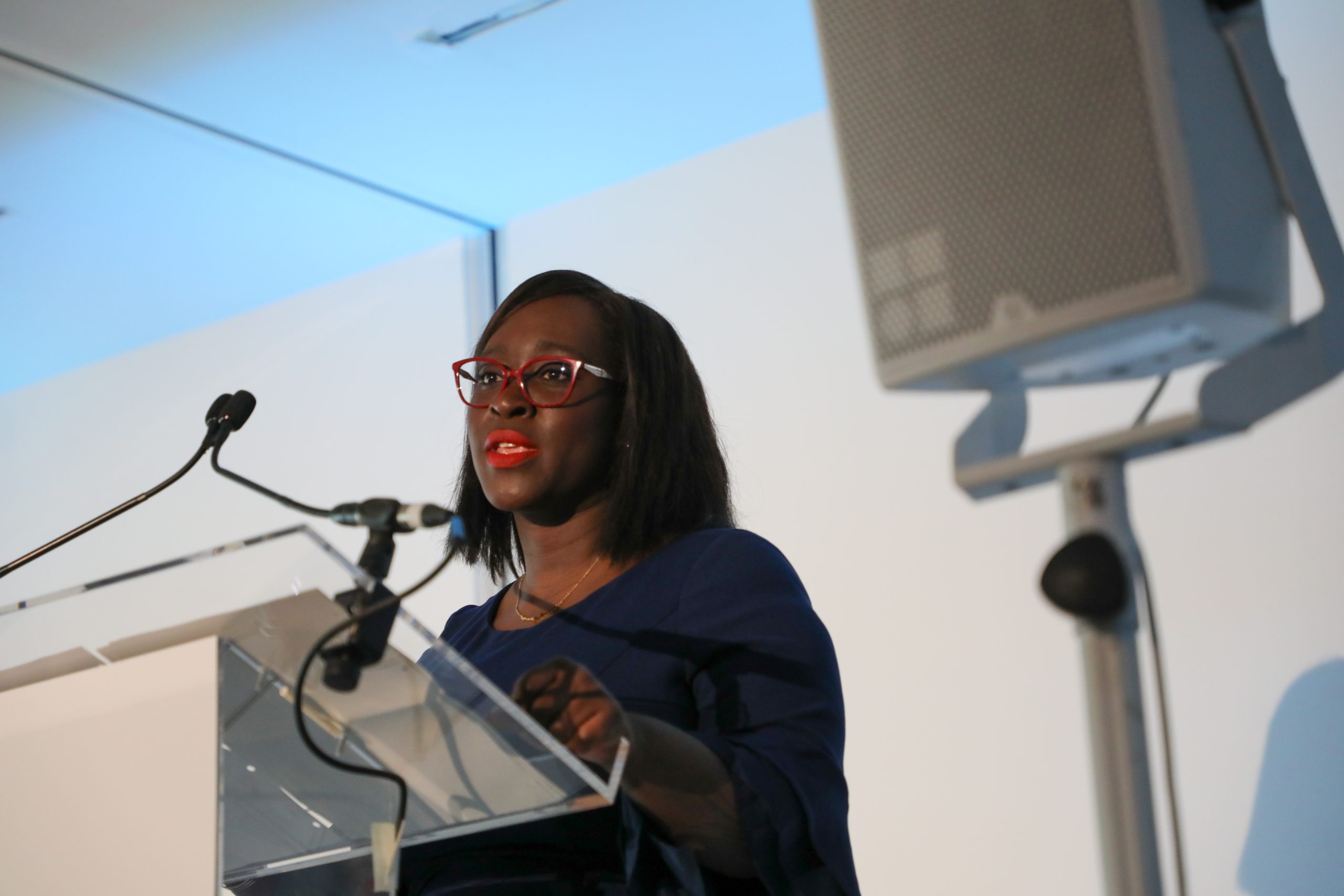 Abena Oppong-Asare, Parliamentary Secretary at the Cabinet Office standing at a lectern speaking at the cyber security conference